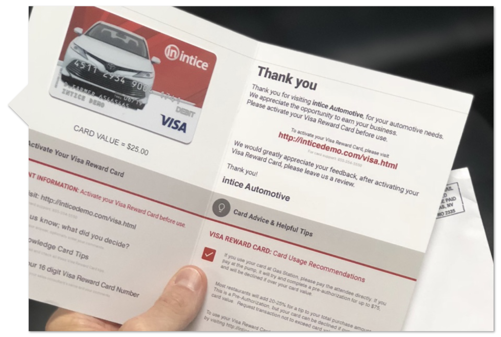 The inside of a pamphlet with a visa gift card showing instructions on how to claim your visa test drive gift card
